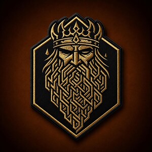 May include: A hexagonal embroidered patch featuring a gold-colored stylized face of a bearded figure wearing a crown. The design uses intricate geometric lines to form the beard and facial features, set against a solid black fabric background.