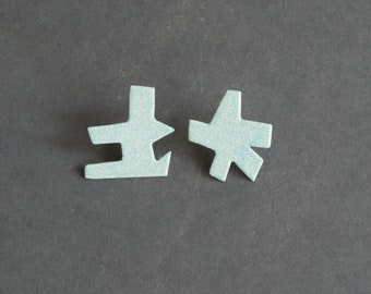 pastel blue asymmetric post earrings, mismatch studs, powder coated, funky modern style, contemporary fashion jewellery, surgical steel