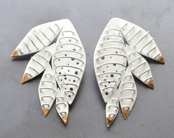 large cage earrings, feather form, gold leaf tips