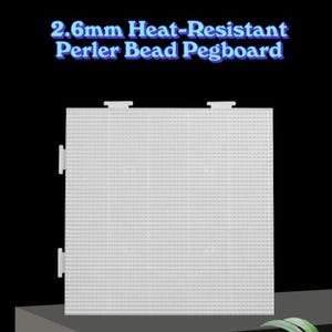 May include: White Perler bead pegboard with the text "2.6mm Heat-Resistant Perler Bead Pegboard" in blue. The pegboard is square with a grid of small holes for bead placement. It has tabs on the top and side for connecting multiple boards.
