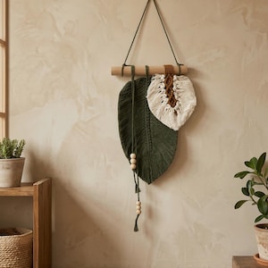 May include: A set of three ceramic mugs with a speckled, matte finish. The mugs are in shades of cream, light grey, and dark grey. Each mug has a simple, minimalist design, ideal for coffee or tea.