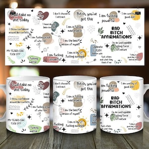 May include: White ceramic mugs with various affirmations in black, red, and green text. The phrases include "I will take no shit today," "I am a fucking masterpiece," and "Bad Bitch Affirmations." The mugs have a white handle and interior.