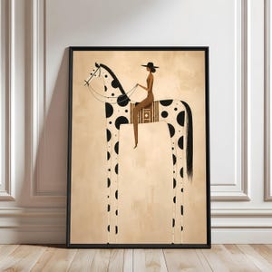 May include: A framed wall art print featuring a stylized illustration of a person wearing a wide-brimmed hat riding a tall, spotted horse. The horse has a long neck and legs, black spots on a cream background, and a black mane and tail.
