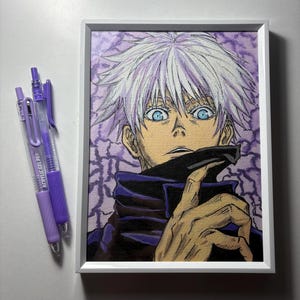 May include: A framed artwork featuring a character with white spiky hair and striking blue eyes. The artwork is in a white frame, and two purple acrylic gel pens are next to it. The background is a purple pattern.