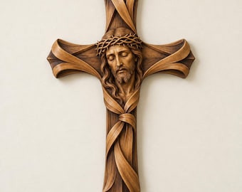 May include: A brown wooden wall cross featuring a sculpted relief of a face wearing a crown of thorns. The cross is designed with flowing, ribbon-like wood elements that wrap around the central figure, creating a textured and layered appearance.