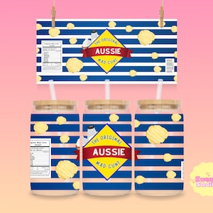 May include: Three glass tumblers with blue and white striped designs, each featuring a yellow diamond with the text "AUSSIE MAD CUNT". The design includes a chip graphic and a nutrition label. A matching sign hangs above.