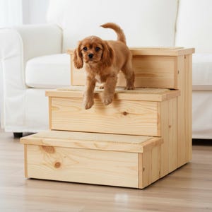 May include: A white ceramic mug with a black handle and the text "But First, Coffee" in a bold, black font. The mug is set against a blurred background, suggesting a cozy setting.