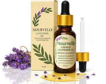 May include: A brown glass bottle of Nourvelle French Lavender Oil with a gold cap and dropper, next to a box with the same branding. A small bouquet of lavender and a puddle of oil with lavender petals are also present.