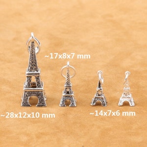 Puede incluir: Cuatro abalorios de plata en forma de Torre Eiffel de diferentes tamaños. El abalorio más grande mide aproximadamente 28x12x10 mm, el siguiente más grande mide aproximadamente 17x8x7 mm y los dos abalorios más pequeños miden aproximadamente 14x7x6 mm.
