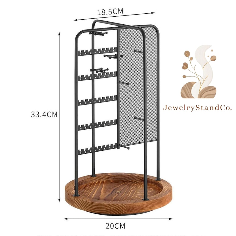 May include: A black metal jewelry display stand with a wooden base. The stand is 13.1 inches tall, 7.3 inches wide, and the base is 7.9 inches in diameter. It features multiple earring slots and a mesh panel for hanging necklaces. The base is made of light brown wood.