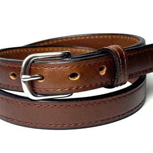 Close view of matching stitching and raised center on brown leather belt