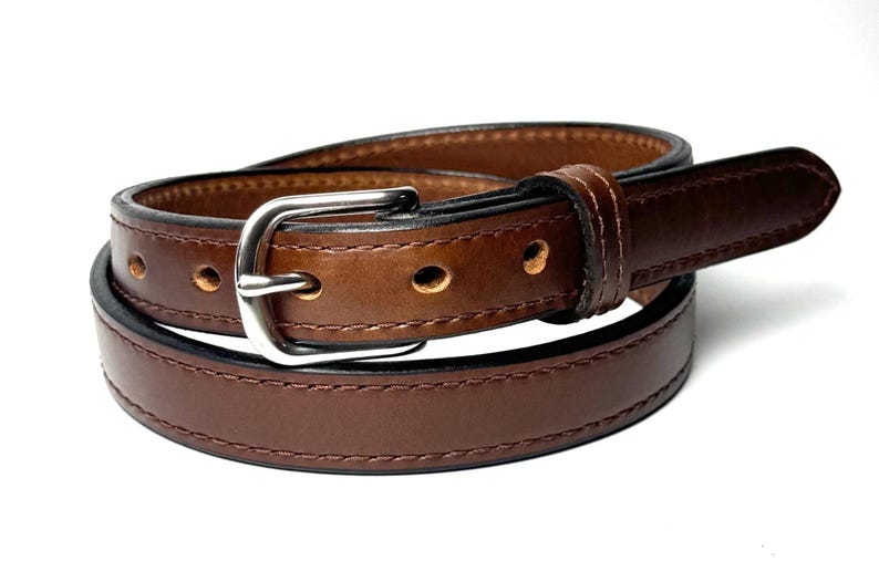 Close view of matching stitching and raised center on brown leather belt