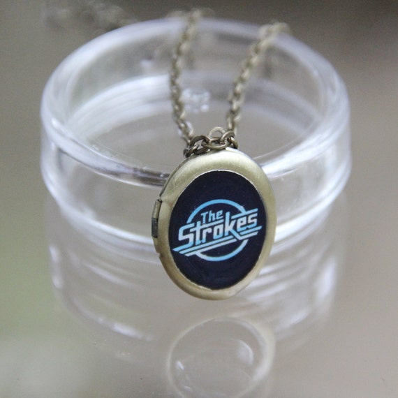Items similar to The Strokes band locket w/ chain on Etsy