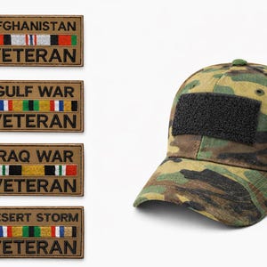 May include: A camouflage baseball cap with a black square patch and four rectangular patches with text and ribbon designs. The patches read "AFGHANISTAN VETERAN", "GULF WAR VETERAN", "IRAQ WAR VETERAN", and "DESERT STORM VETERAN".