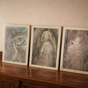 May include: A set of three ceramic nesting bowls in graduating sizes. The bowls feature a speckled, matte finish in shades of cream, light brown, and dark brown. The largest bowl measures approximately 8 inches in diameter.