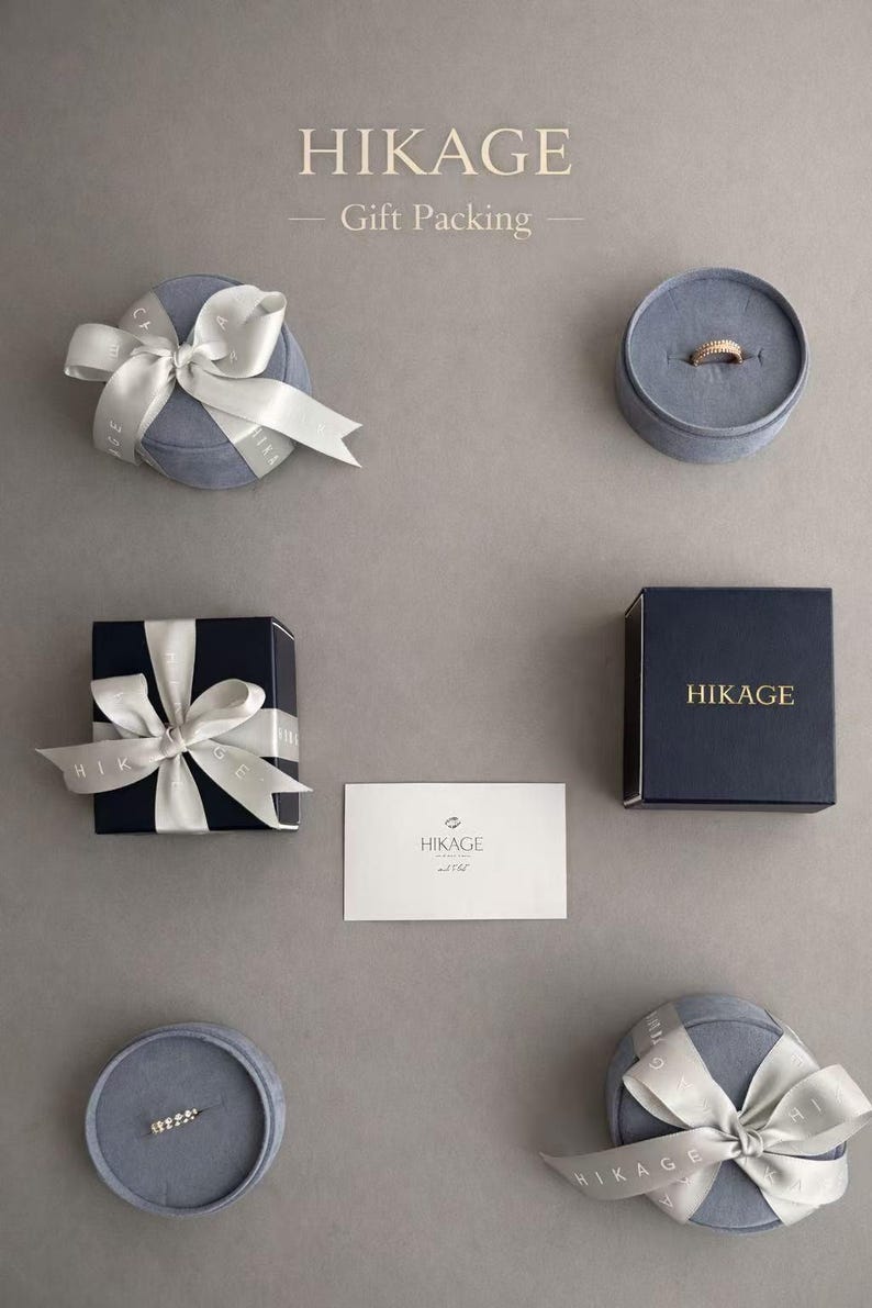 May include: A set of three ceramic mugs with a speckled, matte finish in cream, light brown, and dark brown. Each mug has a simple design and a rounded handle.