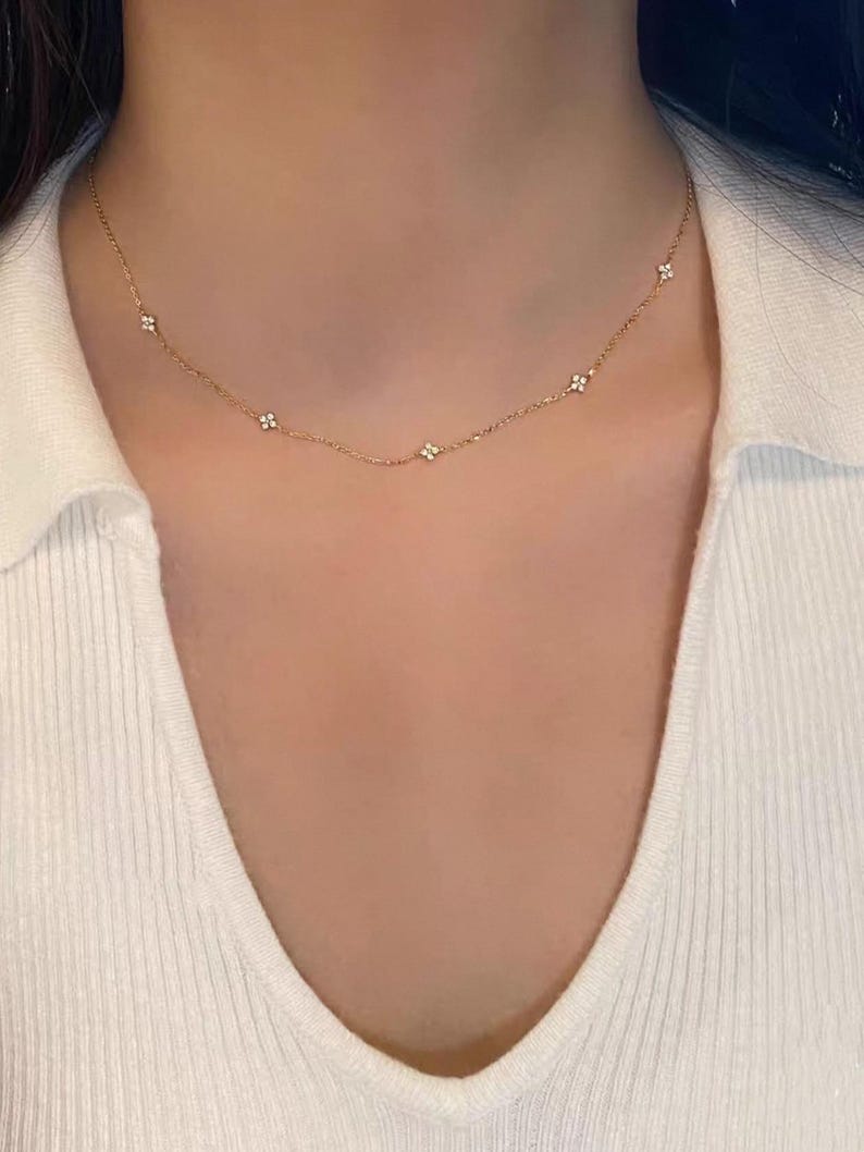 May include: A trio of ceramic mugs with a speckled, matte finish in cream, light grey, and dark grey. Each mug features a minimalist design and a rounded handle.