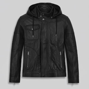 May include: Black leather jacket with a hood, a front pocket, and two zippered pockets. The jacket has ribbed detailing on the sleeves and a button-up collar. The jacket is a classic style.