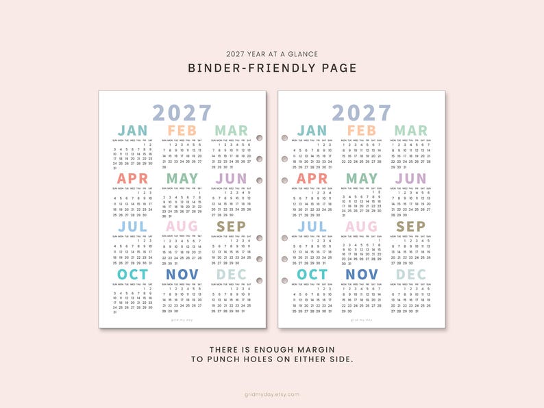 May include: Two white 2027 year-at-a-glance calendar pages with pastel-colored month headings. The text reads 2027 YEAR AT A GLANCE BINDER-FRIENDLY PAGE and THERE IS ENOUGH MARGIN TO PUNCH HOLES ON EITHER SIDE. One page features pre-punched holes.