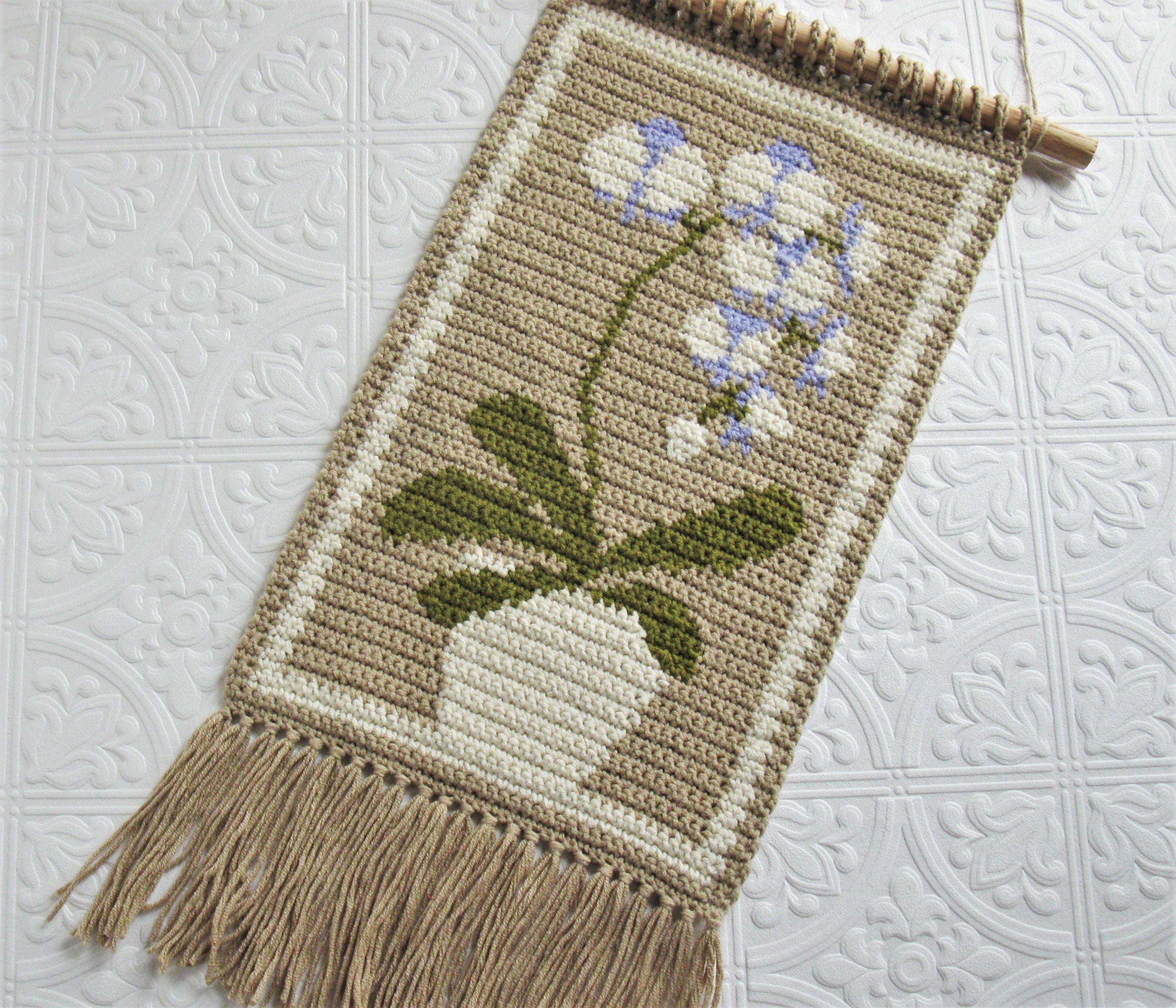30 Orchid Crochet Patterns to Stitch Elegant Blooms for Home Decor and Gifts 13 White Orchid Wall Hanging in Intarsia Crochet