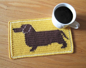 Dachshund dog crochet pattern. Mug mat pattern with a chocolate brown weenie dog.