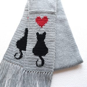 Cat scarf. Gray knit scarf with minimalist black cat silhouettes and red hearts. Kitty lovers gifts