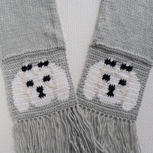 Maltese Scarf. Gray knit scarf with Maltese dogs with black bows. Dog lover gift