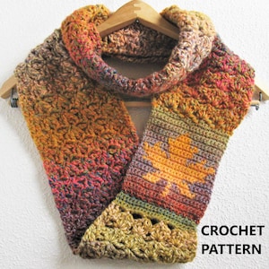 May include: A handmade crochet cowl scarf in autumn colors, including orange, yellow, and brown. The scarf features a leaf design and the text "CROCHET PATTERN". The scarf is displayed on a wooden hanger.