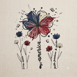 May include: Embroidered floral design with a large flower in red, white, and blue, with the word "America" in cursive. Additional flowers and butterflies are scattered around the design. The text "faith freedom & pride" is also included.