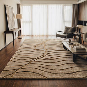 May include: A beige rectangular rug featuring a pattern of brown and gold wavy lines. The rug is placed in a room with hardwood flooring, large windows, and contemporary furniture. The rug's design adds a touch of elegance.