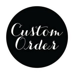 May include: A circular black sticker or graphic featuring the white text Custom Order written in a flowing, cursive script font. The design is centered on a solid black background, creating a high-contrast look for this specific label.