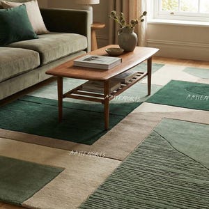 May include: A modern living room scene featuring a green sofa, wooden coffee table, and a patterned rug. The rug has geometric shapes in shades of green and beige. The room is well-lit with natural light.