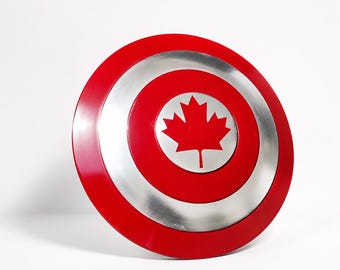 Réplica do escudo da folha de bordo canadense, adereço decorativo redondo em metal vermelho e prateado.