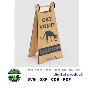 May include: A-frame sign made of light brown wood with the words "CAT VOMIT" and a silhouette of a cat vomiting. The word "CAUTION" is below the cat graphic. The sign is a digital product.