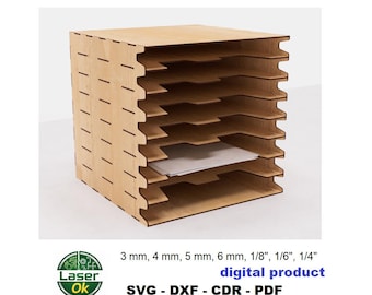 May include: A light brown, laser-cut wooden organizer with multiple shelves. The organizer is designed with a series of horizontal slots, perfect for storing papers or small items. The text "digital product" is visible, along with file format options.
