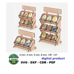 May include: Wooden display stands with three shelves, each holding decorative, painted egg-shaped ornaments. The stands are made of light-coloured wood. The image also includes text that says "digital product" and lists various file formats and thicknesses in mm and inches.