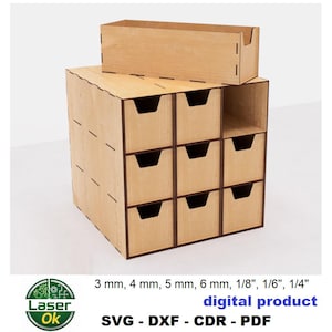 Peut inclure: Un meuble de rangement en bois clair avec neuf tiroirs et une étagère supérieure. L'unité est fabriquée en bois découpé au laser et présente un design simple et moderne. Le texte "digital product" est visible.