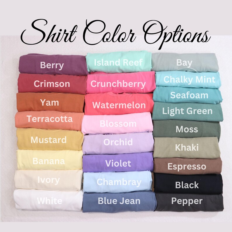 May include: A display of folded shirts in various colors, including Berry, Crimson, and Yam. The image features the text "Shirt Color Options" in a decorative font, showcasing a range of hues from pastels to darker shades.