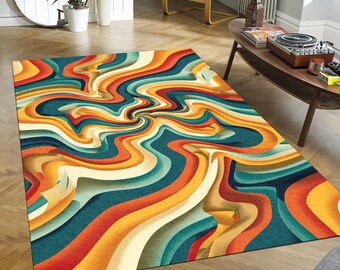 May include: A rectangular area rug with a vibrant, swirling pattern in shades of orange, yellow, teal, and cream. The design features a central vortex of color, creating a dynamic and eye-catching visual effect. This rug is suitable for living rooms and bedrooms.