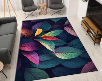 May include: A rectangular area rug featuring a vibrant leaf design. The rug showcases a dark blue background with large leaves in shades of green, purple, red, and yellow. The leaves are arranged in a natural pattern, creating a colorful and artistic floor covering.