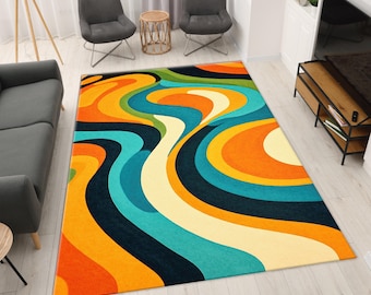 May include: A large, rectangular area rug with a vibrant, retro design. The rug features a swirling pattern of orange, yellow, teal, and navy blue. The rug is placed on a light-colored wooden floor, adding a pop of color to the room.