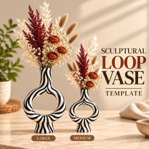 May include: Two ceramic loop vases with a black and white zebra stripe pattern, one large and one medium, each filled with dried flowers in shades of deep red, cream, and tan. The text SCULPTURAL LOOP VASE TEMPLATE is visible on the right side.