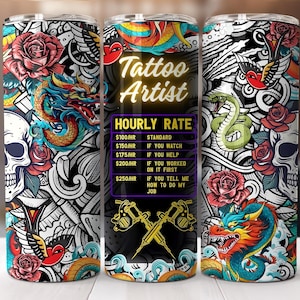 May include: A stainless steel tumbler with a tattoo-themed design. The design includes a skull, roses, a dragon, and a snake, with the words "Tattoo Artist" and hourly rates. The tumbler is approximately 8 inches tall.