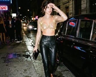 This gold rhinestone mesh long-sleeved backless cropped top is dazzling and perfect for parties, nightclubs,festivals, and nighttime outings