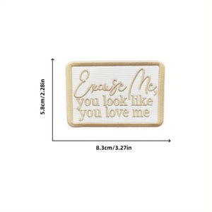 May include: A rectangular patch with the text "Excuse Me, you look like you love me" embroidered in gold thread. The patch is 3.27 inches wide and 2.28 inches tall, with a gold border and a white background.