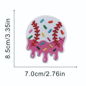 May include: Embroidered patch in the shape of a baseball with a pink, dripping ice cream design. The patch is 3.35 inches tall and 2.76 inches wide, with colorful sprinkles and red stitching details.