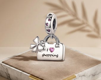 Colgante con dije de bolso de compras de cristal rosa