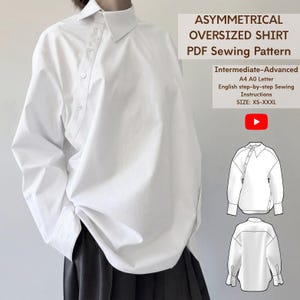 May include: A white oversized shirt with an asymmetrical button placket and long sleeves. The image includes text: ASYMMETRICAL OVERSIZED SHIRT PDF Sewing Pattern, Intermediate-Advanced, A4 A0 Letter, English step-by-step Sewing Instructions, SIZE: XS-XXXL.