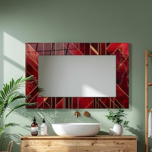 May include: A rectangular wall mirror featuring a decorative frame with a deep red marble pattern and gold geometric lines. The frame displays a mix of solid red sections, veined marble textures, and thin gold accents arranged in a grid pattern.