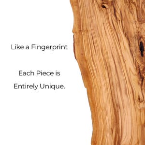 May include: A slab of light brown olive wood with a natural live edge and dark brown grain patterns. The text on the left side reads: Like a Fingerprint Each Piece is Entirely Unique. The wood surface shows organic knots and swirls.